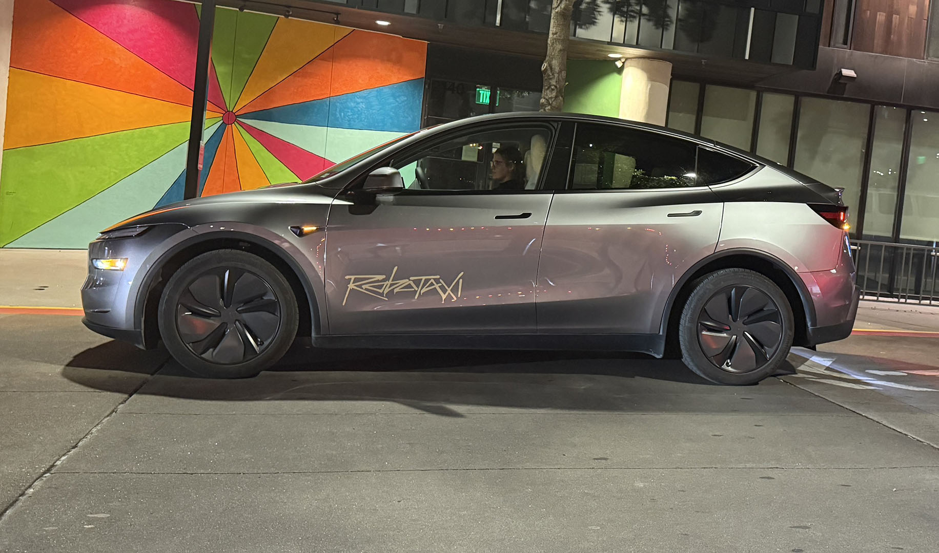 Tesla Model Y in Robotaxi livery on the Wheelbase showroom floor